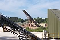 Upwards loading conveyors in the sunshine.