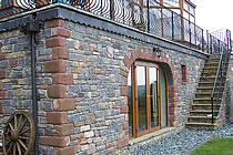 Building clad with cropped walling stone.